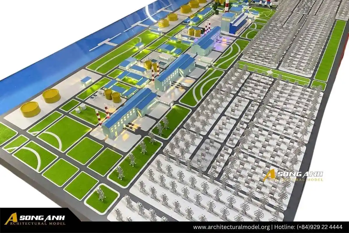 Góc chụp hậu trường quá trình Mô hình Song Anh hỗ trợ điều chỉnh và hoàn thiện bản vẽ kỹ thuật trên sa bàn nhà máy nhiệt điện tại Cần Thơ.